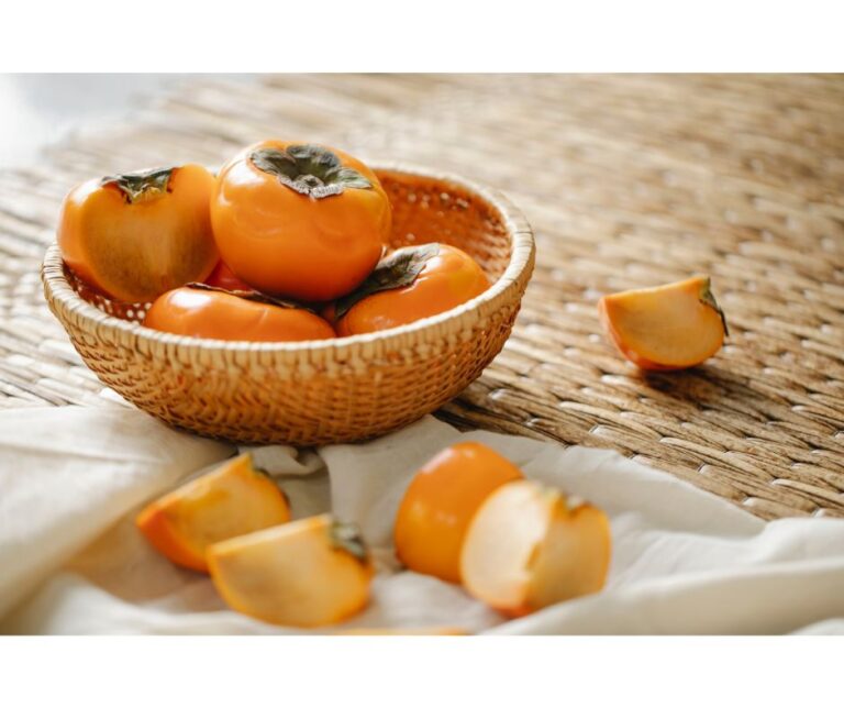 Persimmons-orange-in-color-paced-on-table